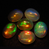 calebrated size 7x9 mm oval - Ethiopian Opal - really - tope grade high quality CABOCHON - oval shape - each pcs - have amazing - beautifull - flashy fire all around in the stone -6 pcs - approx -- STUNNING QUALITY - VERY VERY RARE